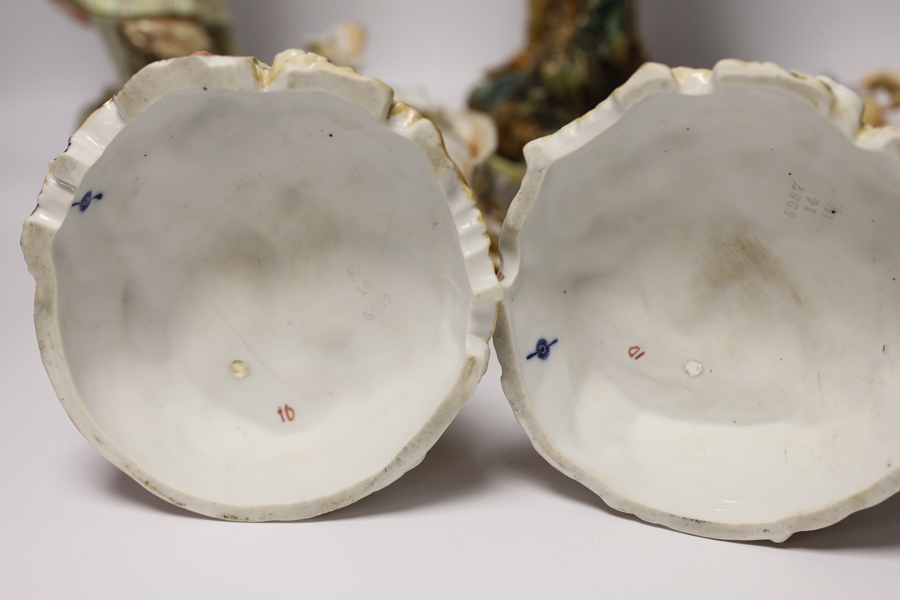 A pair of Volkstedt porcelain figures and a pair continental earthenware figures, 42cm
